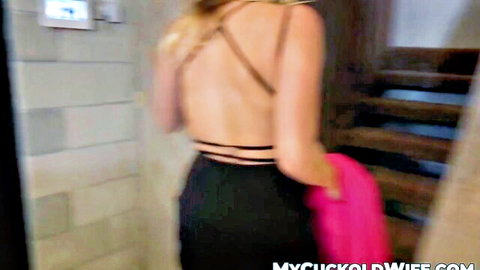Blonde Cadence Lux in backless black dress, teasing cuckold hubby