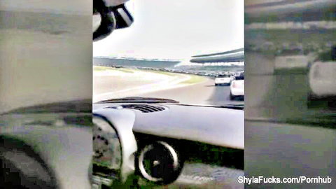 Shyla Stylez behind the scenes on race track in car dashboard view