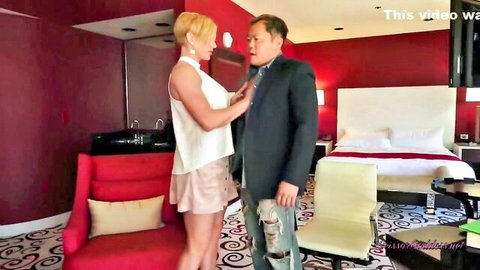 Goddess Rapture adjusts tie of suited employee in intimate tease