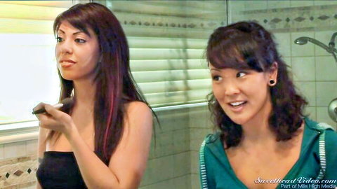 Jandi Lin and Satine Phoenix in teasing bathroom duo pose