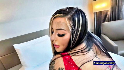 Mature tattooed Latina Valentina with big phat butt in sexy red top