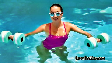 Curvy brunette in pink swimsuit doing aqua workout in pool
