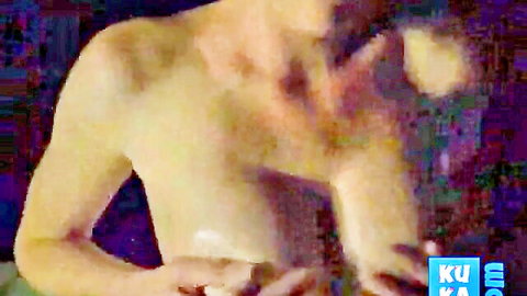 Blonde woman topless showing breasts in pixelated close-up