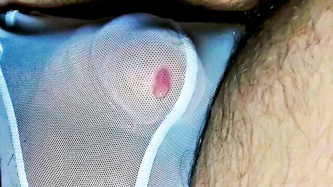 Man in blue mesh underwear with visible precum leak