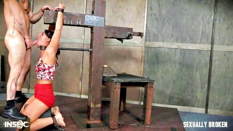 Brunette mouth fucked in BDSM restraints by dominant man