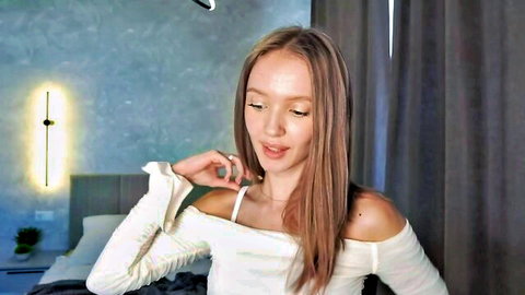Shy young blonde teen in off-shoulder top on Chaturbate webcam