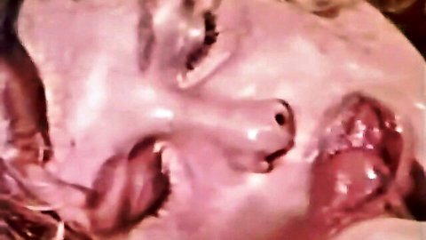 Blonde woman with cum on face and open mouth after blowjob