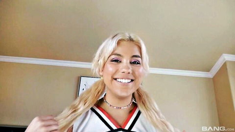 Lilith Grace blonde cheerleader smiling in sexy uniform pigtails