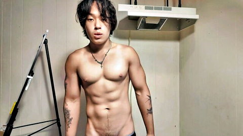 Muscular Japanese model Chang Lu flexing nude and displaying his cock