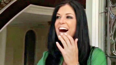 Caprice Jane smiling playfully in green dress, teasing porn thumbnail