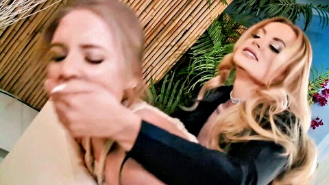Blonde woman hand-gags another in dominant tease, strap-on boss scene