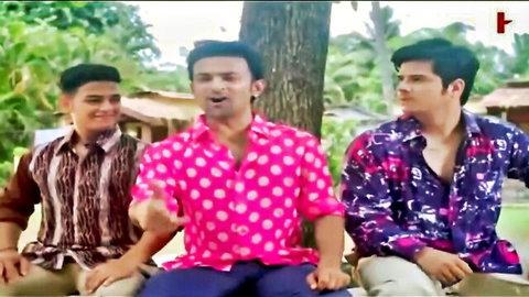 Three young Indian men in vibrant shirts gesturing outdoors