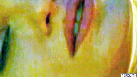 Blurry close-up of two women in outdoor lesbian encounter on sunbed