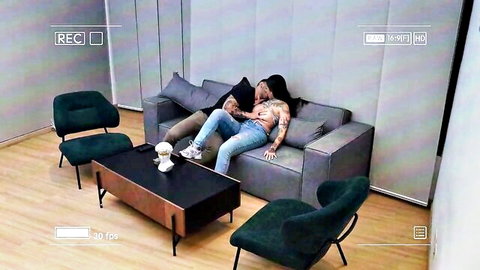 Amateur couple passionately kissing on couch, tattooed guy with friend's girlfriend