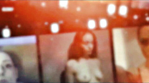 Kiki in chastity prison, topless brunette exposed in blurred display