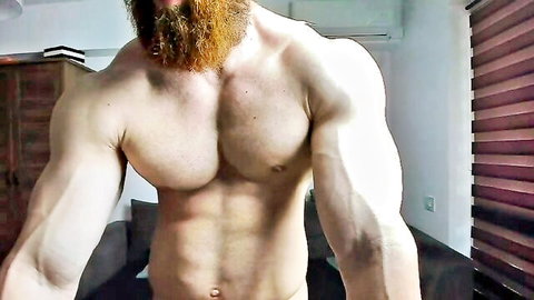 Bearded muscular man ZkkBlitz showcasing ripped abs and chest