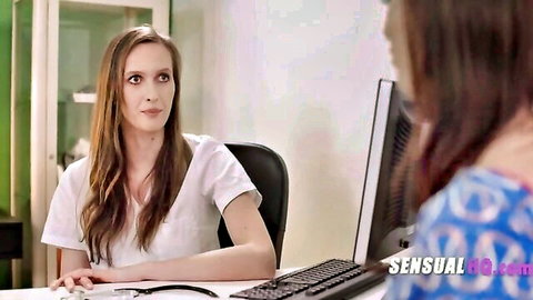 Brunette nurse in white blouse sits at desk eyeing patient in lesbian medical office
