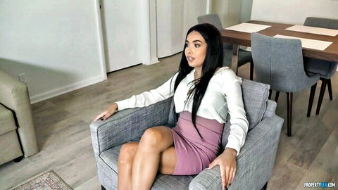 Aaliyah Hadid in white blouse and pink mini skirt, seductive pose