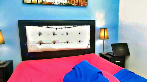 Sandra Grace Cam4 bedroom setup with decorated mirror bed