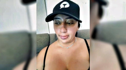 Hannahoff latin brunette in black cap and low-cut top, teasing cleavage on webcam