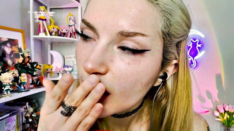 Blonde ASMR girl with choker does spit painting close-up