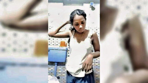 Naughty Indian teen in wet white tank top and blue shorts, teasing pose
