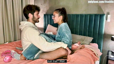 Intimate amateur couple cuddling on bed, step-sister lays with brother