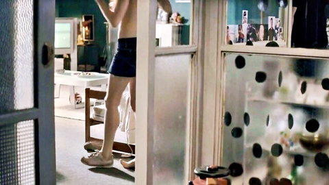 Michelle Williams topless in shorts, standing in doorway, Incendiary 2008
