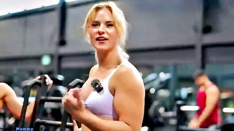Blonde athletic woman in gym sports bra, smiling for first threesome