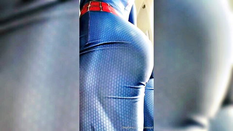 GoonieSyd in tight Spider Girl cosplay, showcasing her curvy ass from behind