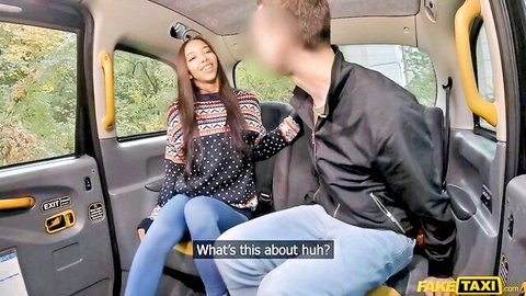 Brunette in sweater and jeans smiles teasingly at blurred guy in Fake Taxi cab