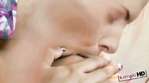 Passionate close-up neck kissing between women, intense embrace