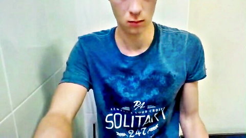 Slim young man in wet blue t-shirt in solo wank session