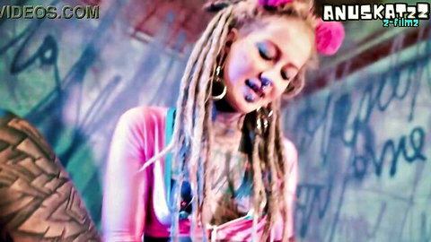 Tattooed dreadlock woman in pink top, solo toy double penetration tease