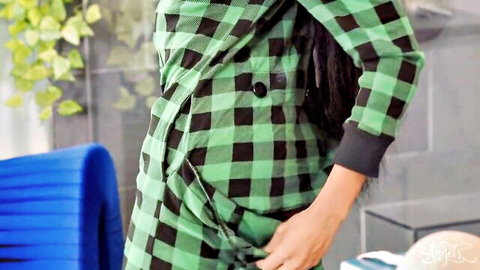 Asian woman in green plaid pajamas pulls down top exposing side tit and nipple