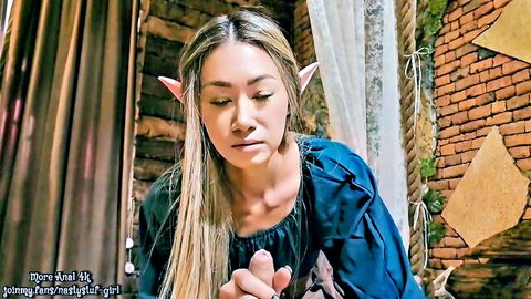 Gorgeous elf cosplay babe with pointed ears in seductive blue top