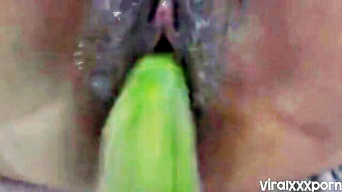 Close-up of safada teasing with huge green monster dildo insertion