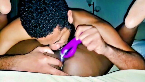 Ebony man eating wife's pussy with purple vibrator closeup
