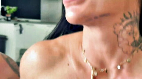 Valentina with intricate neck tattoo, smiling seductively, bare shoulders