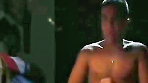Shirtless muscular Asian guy in red shorts, university dorm tease
