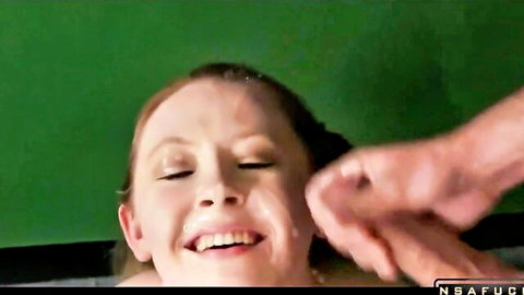 Redhead smiling with massive facial cumshot close-up