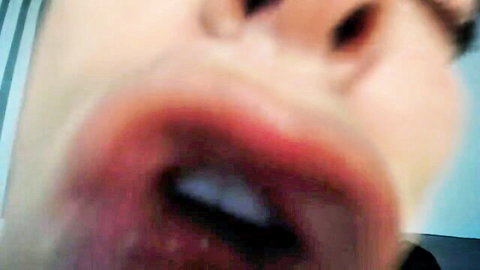 Close-up of hot webcam guy's open mouth teasing oral action