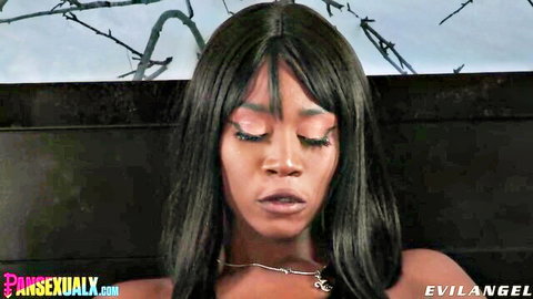 Ebony beauty's close-up aroused face with glossy parted lips and heavy lashes