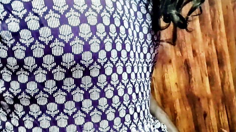 Indian desi woman in purple patterned dress with black hair in tempting pose