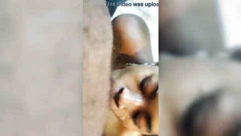 Ebony woman's tear-streaked face gripped roughly during intense domination oral sex