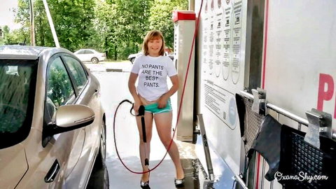 Brunette in 'No Pants' tee and turquoise panties at public car wash tease