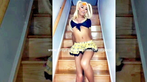 Ebony trans model Nicki Bandz in sexy black top and yellow skirt, blonde pigtails