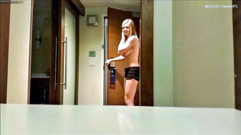 Blonde topless woman in hotel room service, wearing short shorts