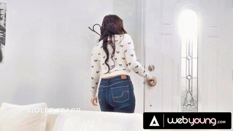Violet Starr in tight jeans and sweater, teasing big ass by door in lesbian roommate scene