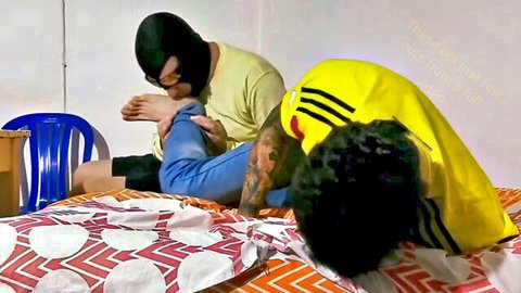 Masked man licks soccer player's bare feet in gay fetish scene